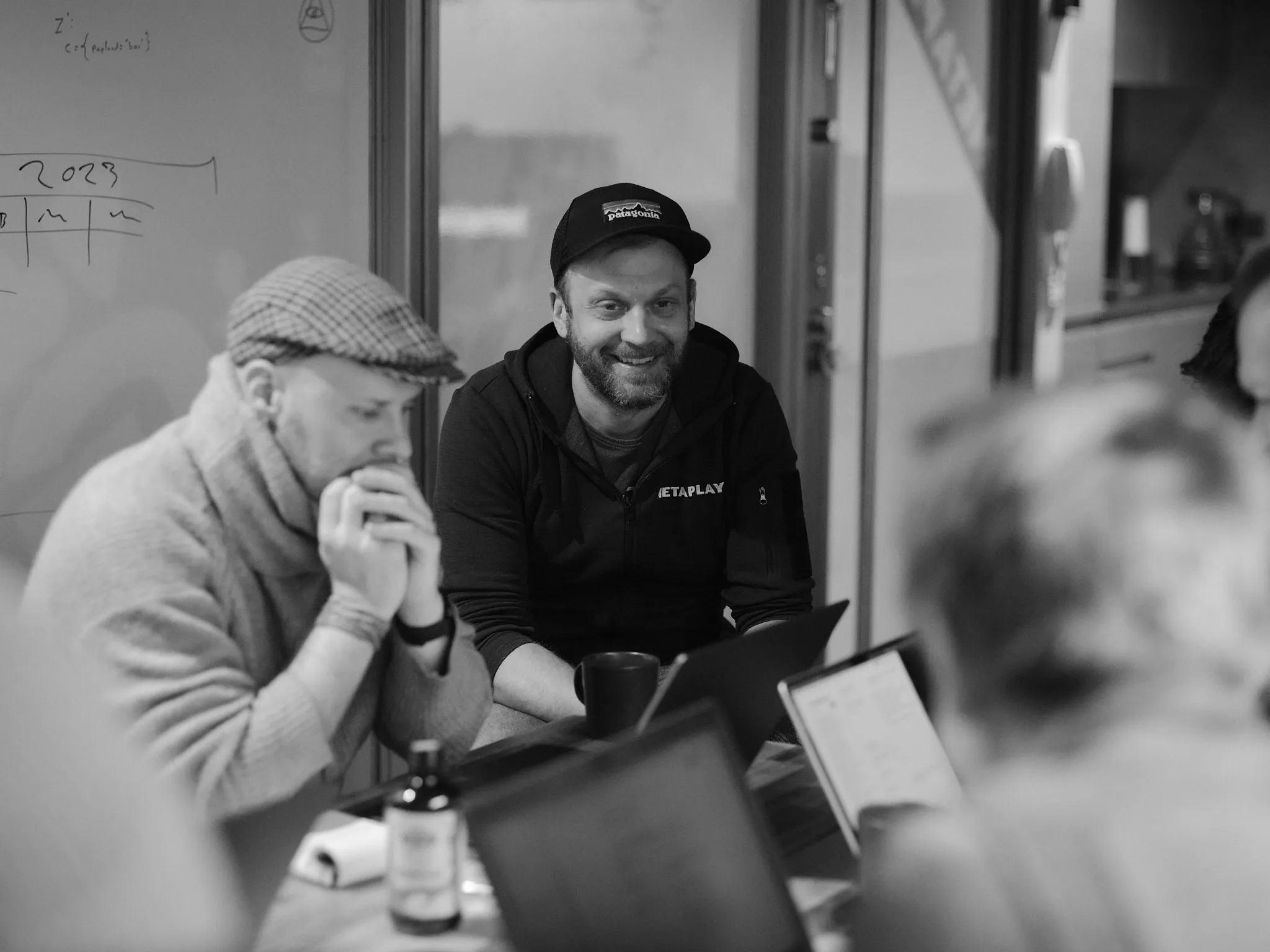 Metaplay team members collaborating and smiling